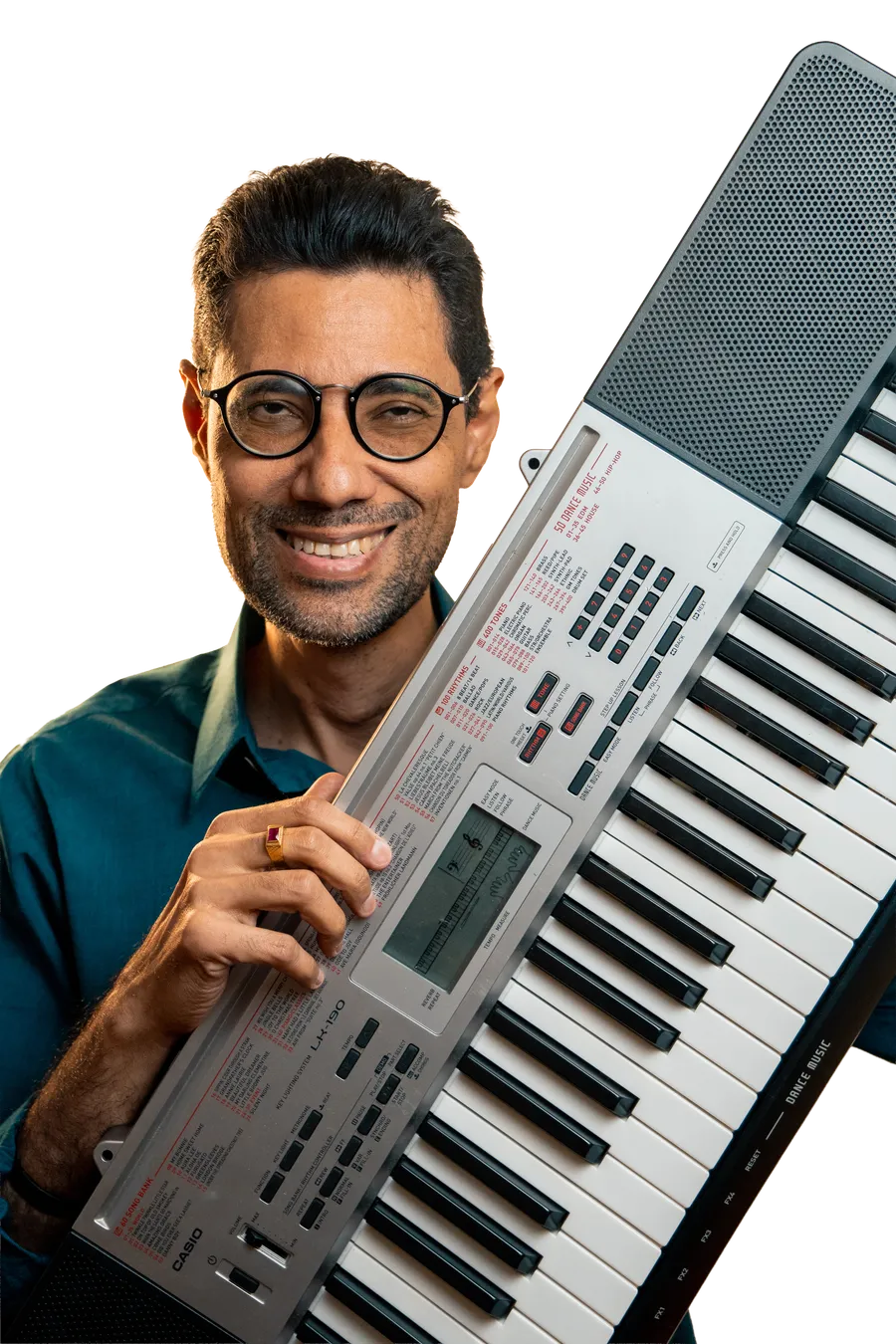 José Silveira smiling, a music teacher who helps students play real songs at home.